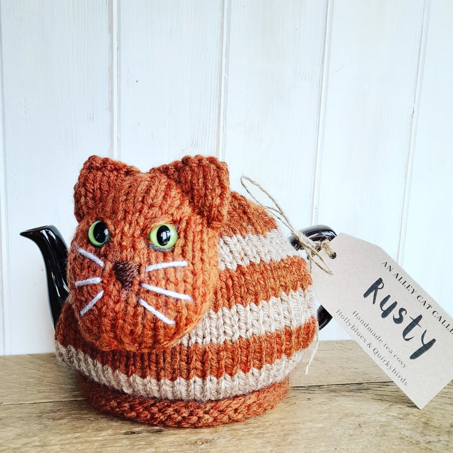 Handknitted cat tea cosy