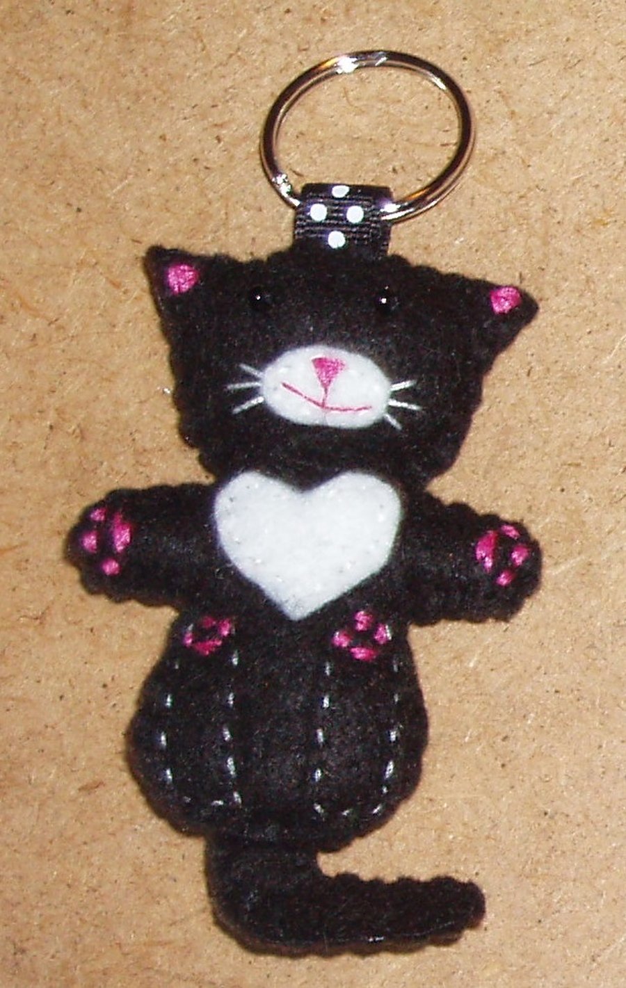 Cat on back Black Felt Keyring-Bag Charm with white chest & muzzle