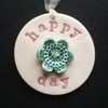 Ceramic decoration Happy Day with flower button