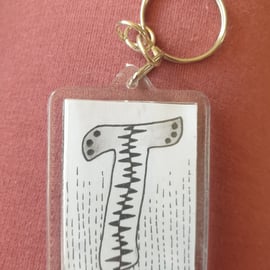 Hand drawn initial "T" keyring.