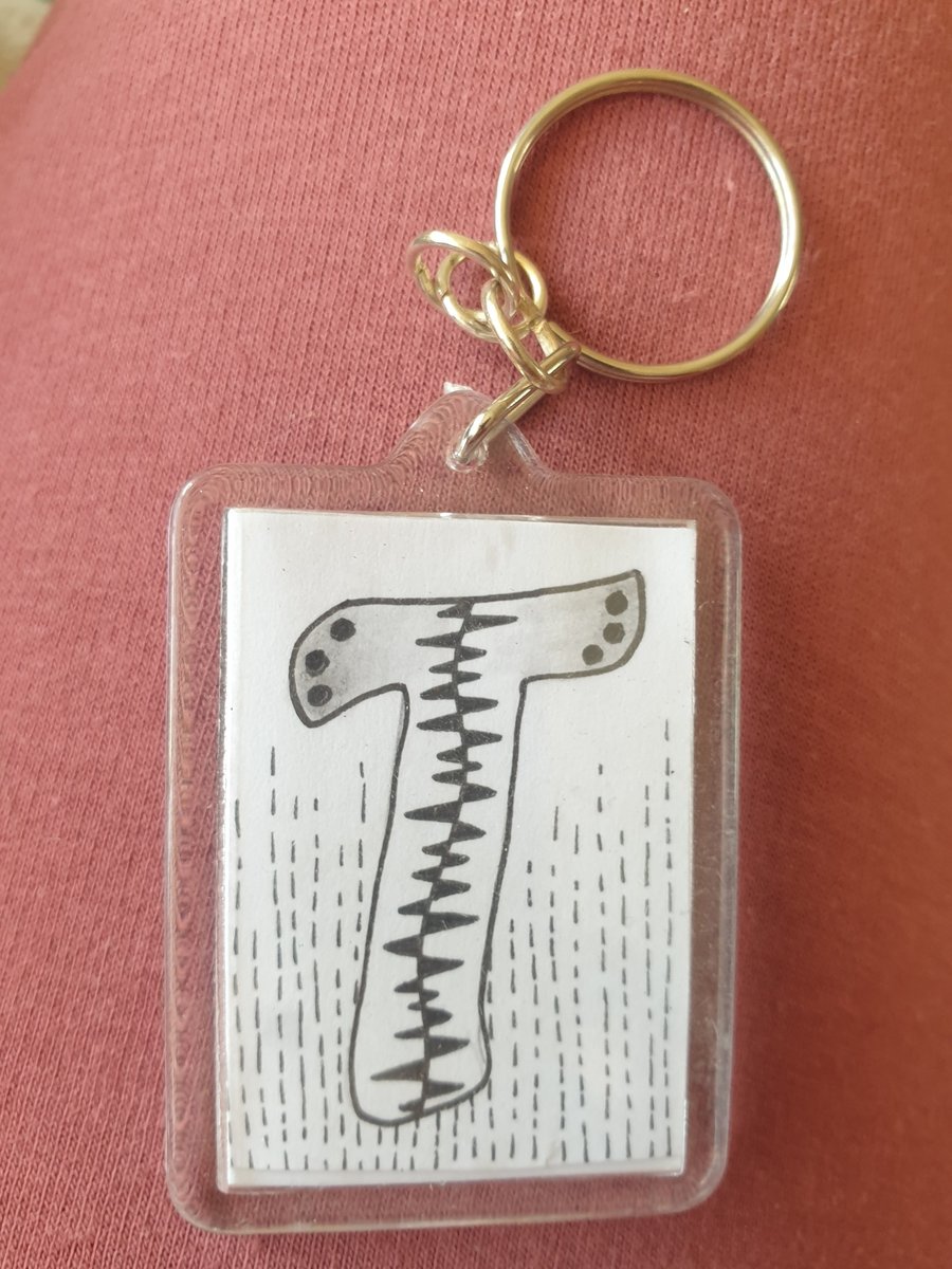 Hand drawn initial "T" keyring.
