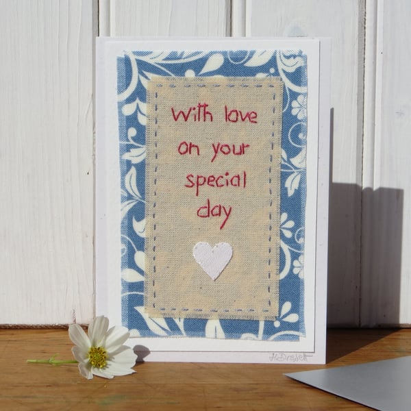 Hand-stitched wedding card with little heart and silver envelope