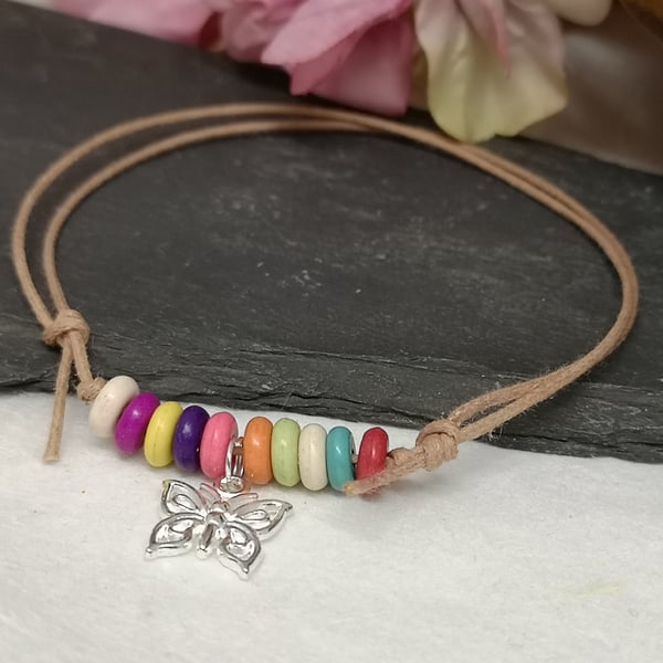 Adjustable cotton cord anklet with rainbow howlite beads and a butterfly charm 