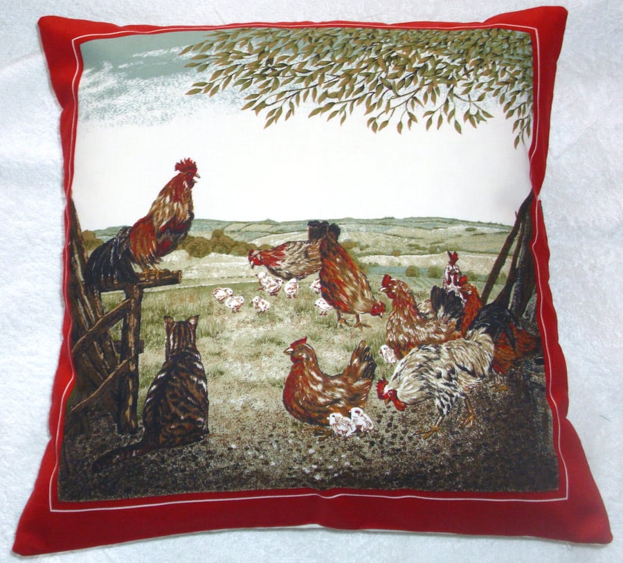 A Tabby cat watching chickens and chicks on the farm cushion 