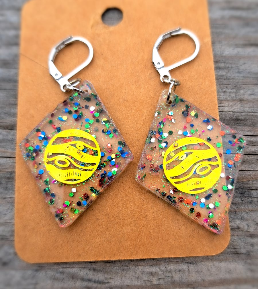 Diamond shape resin dangle earrings with a selection of glitter and moon