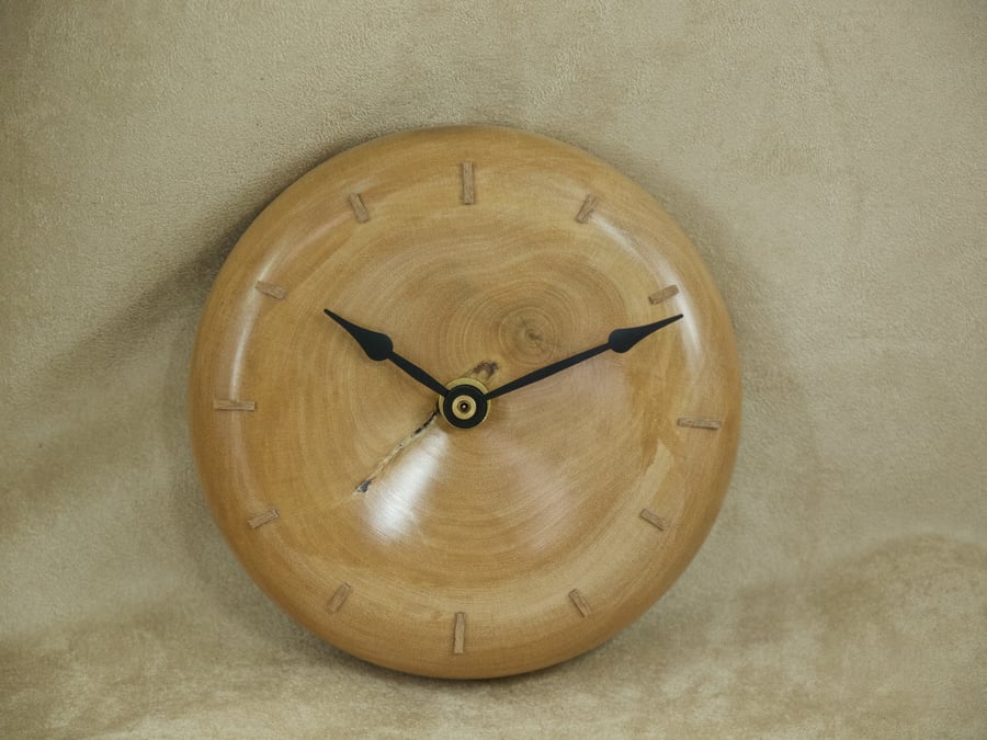 Wood wall clock hand crafted from holly circular design. PR475