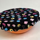 One medium reusable bowl cover to fit a 19cm bowl. Licorice Allsorts