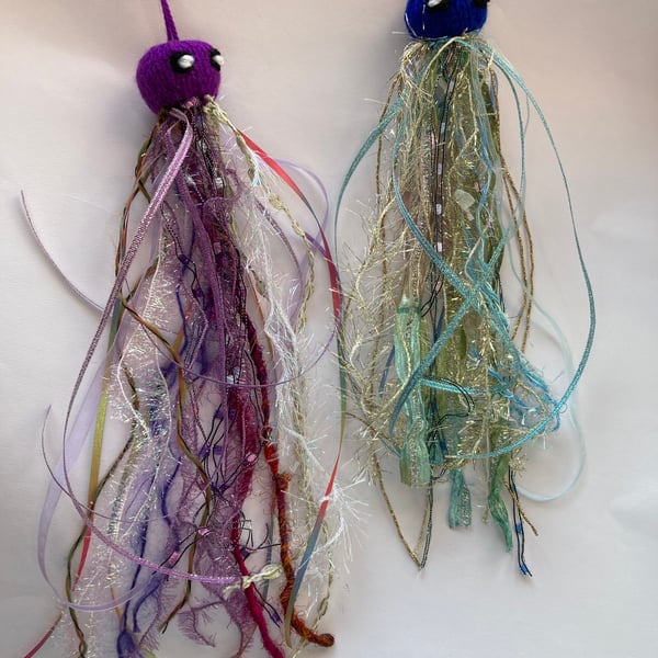 2 hand knitted sparkly jellyfish