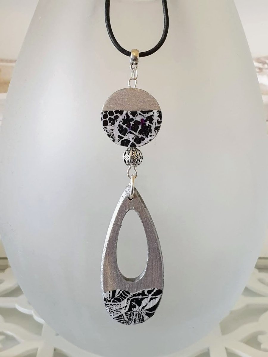 Geometric wood pendant on leather cord