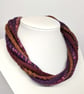The Wrapped Twist: felted cord necklace in muted autumnal shades