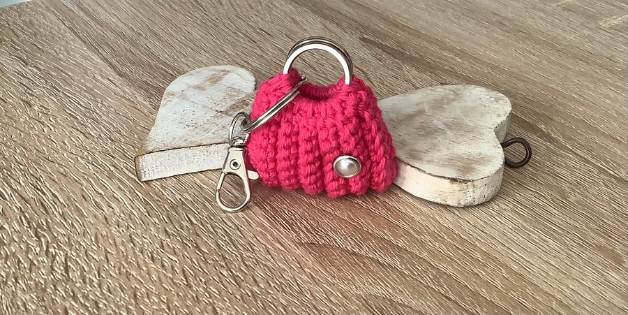 Small bag key, ear buds, spare coins holder.