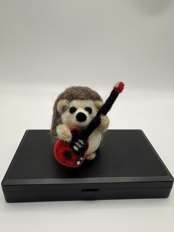 Handmade needle felted hedgehog inspired by Brian May Queen with guitar