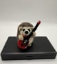 Handmade needle felted hedgehog inspired by Brian May Queen with guitar