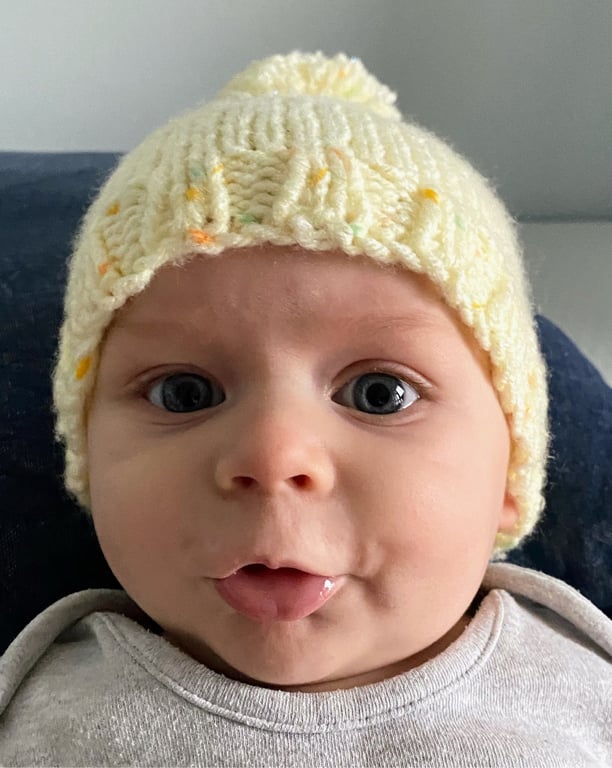 Knitted baby hat yellow