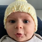 Knitted baby hat yellow