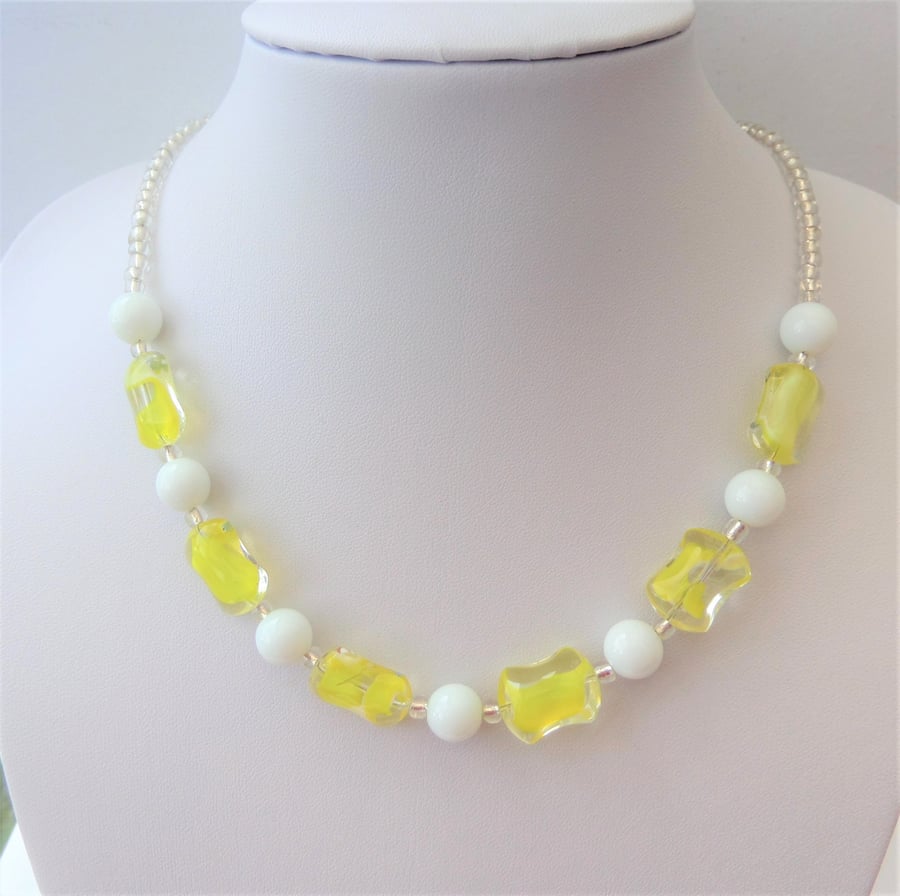Yellow and white glass bead necklace.