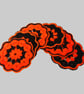 Coasters for Halloween in orange and black, set of six, crochet table mats