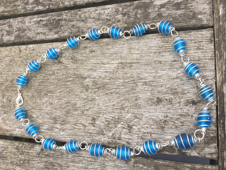 Frosted blue glass beads in wrapped cases necklace