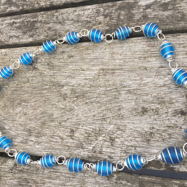 Frosted blue glass beads in wrapped cases necklace