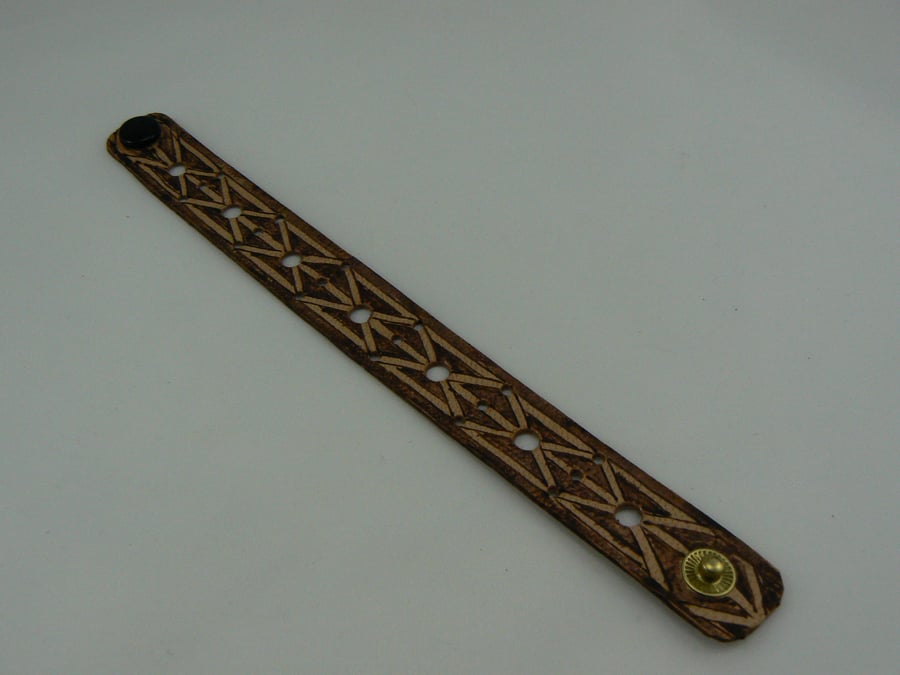 pyrographed leather bracelet featuring gate design
