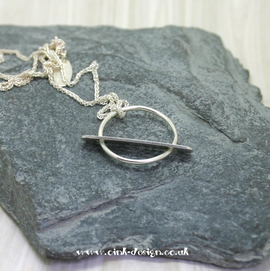 Sterling Silver circle with solid movable flat bar