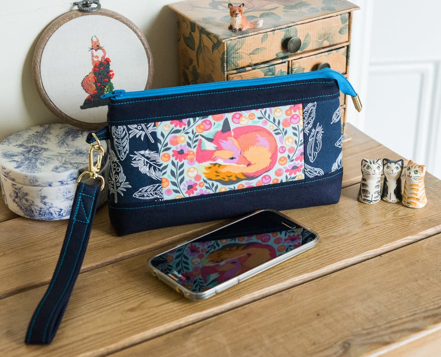 Large purse or small clutch with detachable wristlet featuring sleeping fox