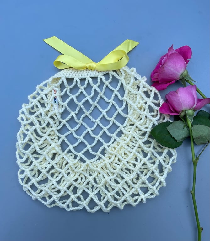 Pale pastel yellow 1940s style retro ribbon snood hairnet with a yellow ribbon