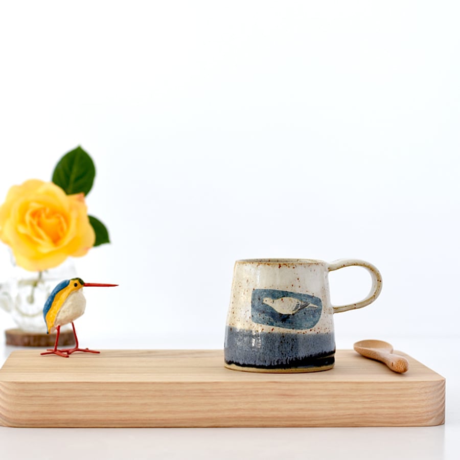 Blue and white ceramic mug with feeding dove - handmade stoneware pottery