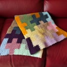 Colourful handmade crocheted blanket - jigsaw puzzle design