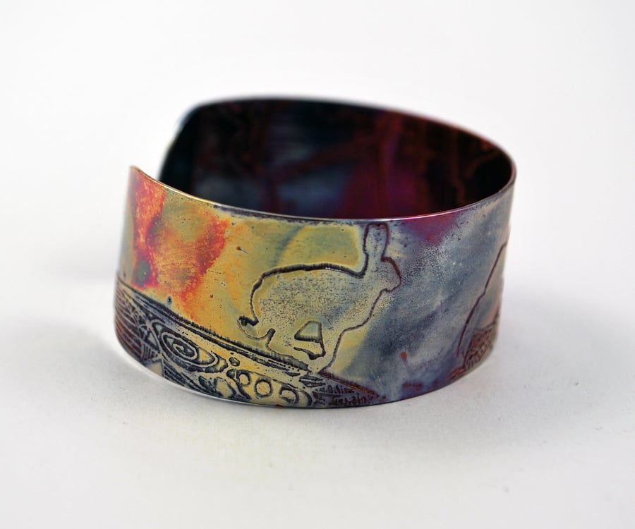 Medium copper Hare cuff, leaping, running, jumping hare
