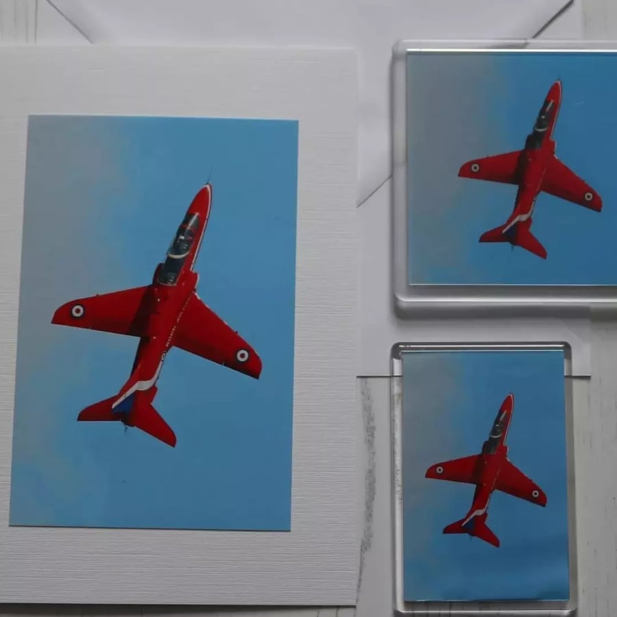 Photo card of a Red Arrow in a vertical climb, with either a coaster or a fridge