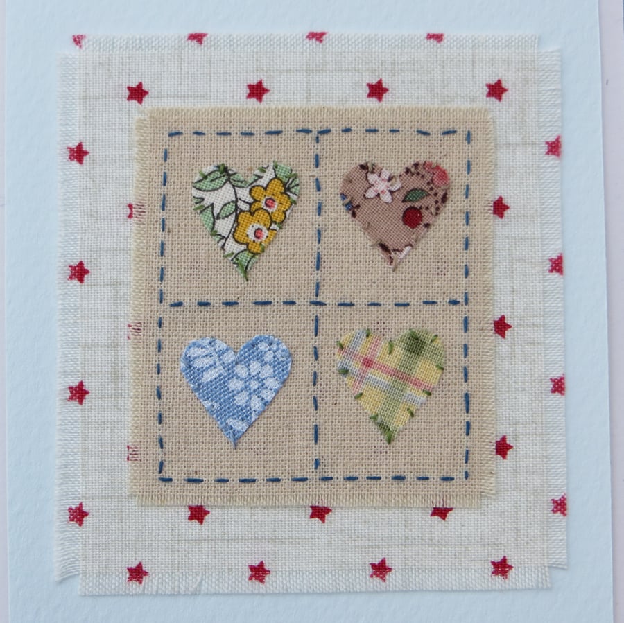 Happy Hearts card hand-stitched miniature textile on starry background