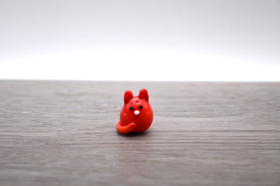 small orange glass cat figure