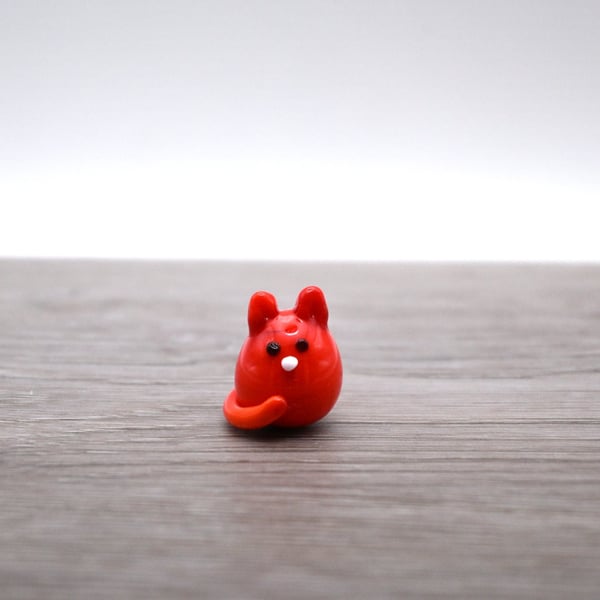 small orange glass cat figure