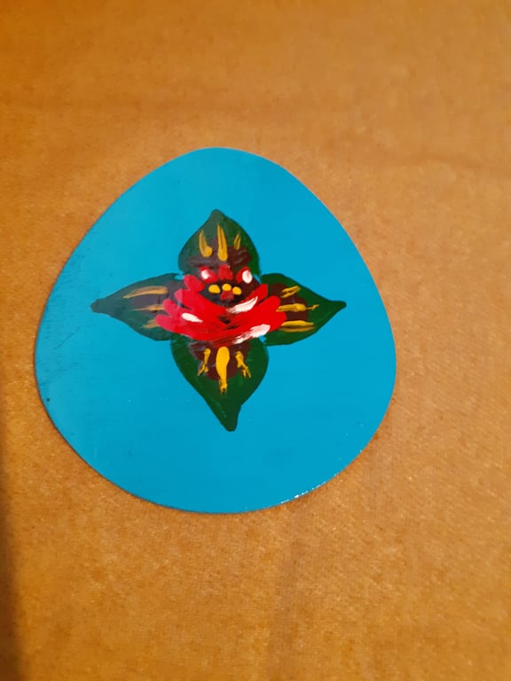 Egg shaped wooden magnet with canal art style rose