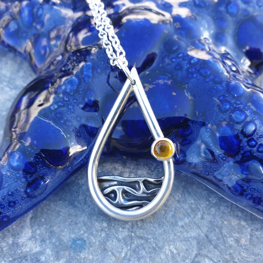 Silver sea mountains hills pendant with amber sun