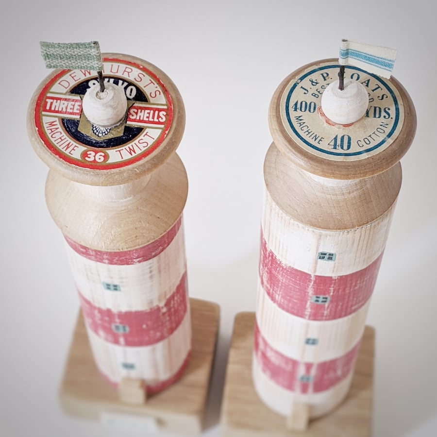 Wooden lighthouse with vintage bobbin and flag 'sea' 'home'