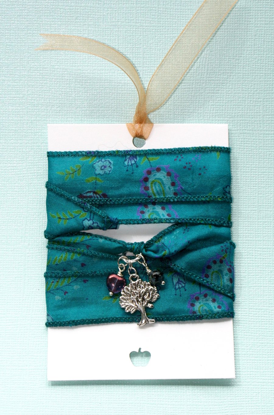 Teal patterned silk wrap bracelet with tree charm