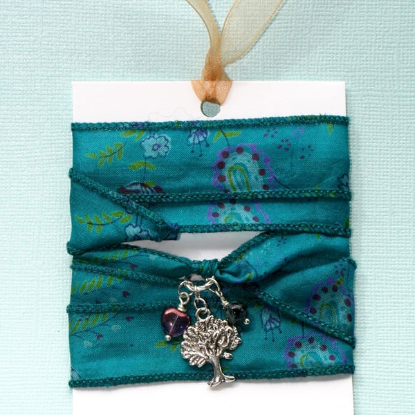Teal patterned silk wrap bracelet with tree charm