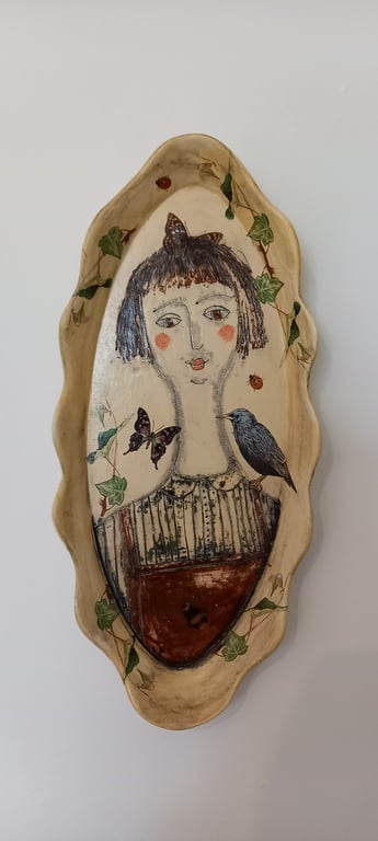 Figurative shallow dish-wall hanging 