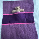 Hand knitted blanket with Teddy in the pocket