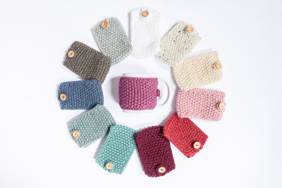 A knitted mug cosy, cup cosy, mug cosies, coffee cosy in a variety of colours.