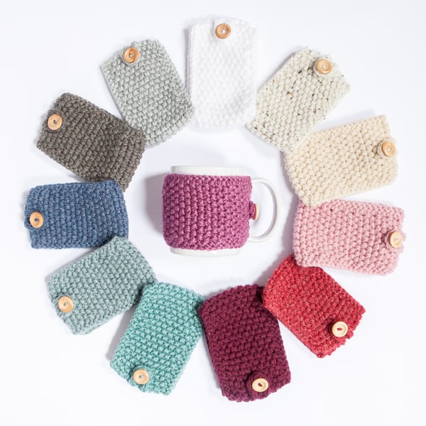 A knitted mug cosy, cup cosy, mug cosies, coffee cosy in a variety of colours.