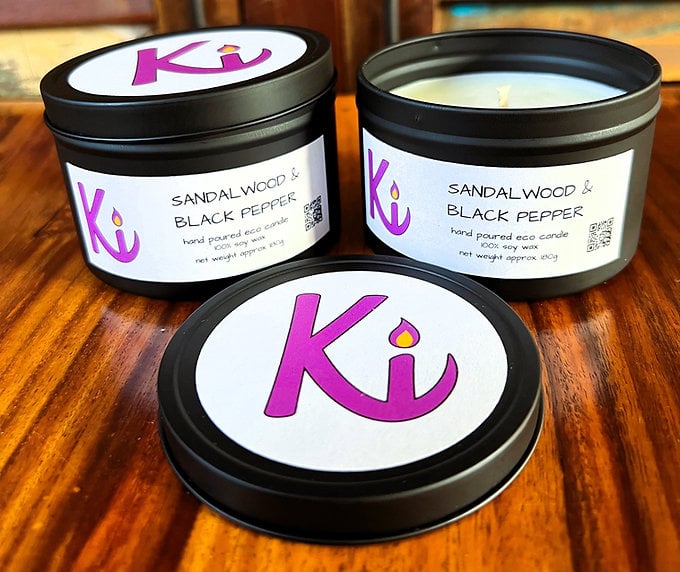 Sandalwood & Black Pepper scented soy candle in a black tin