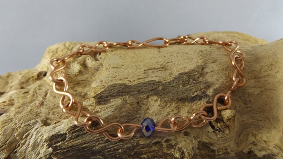 copper bracelet with blue crystal