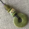 “Womanhood” recycled glass bead pendant in Olive & Purple