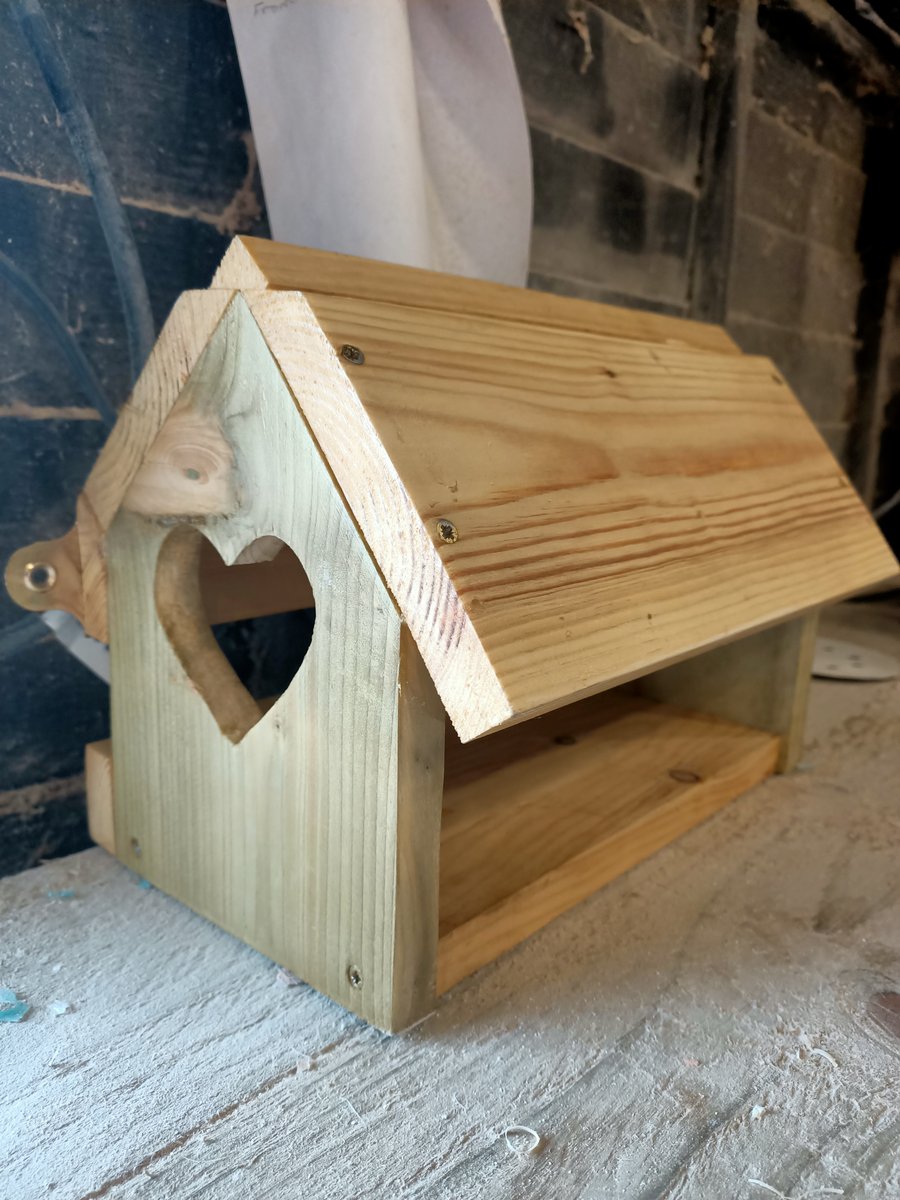 Rustic wooden recycled bird feeder with love hearts