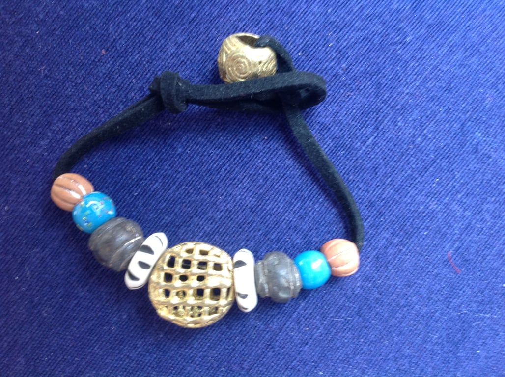 Cord bracelet with beads from Mali, prayer beads and a large African brass bead