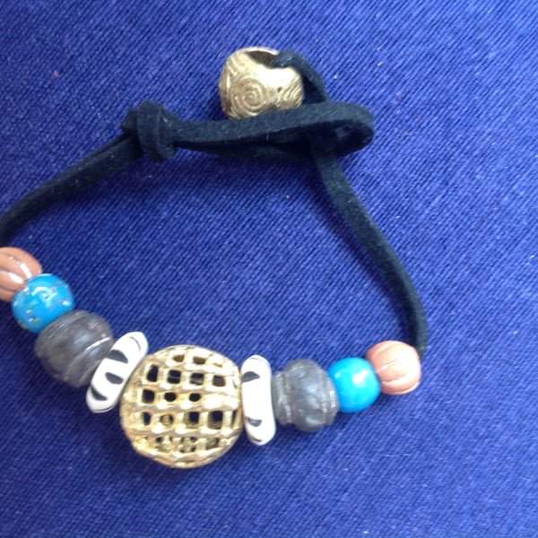 Cord bracelet with beads from Mali, prayer beads and a large African brass bead