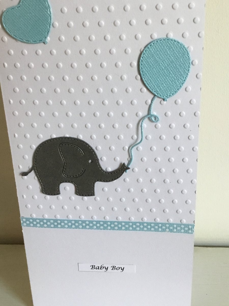 Embossed baby boy card with elephant, heart and balloons. CC194